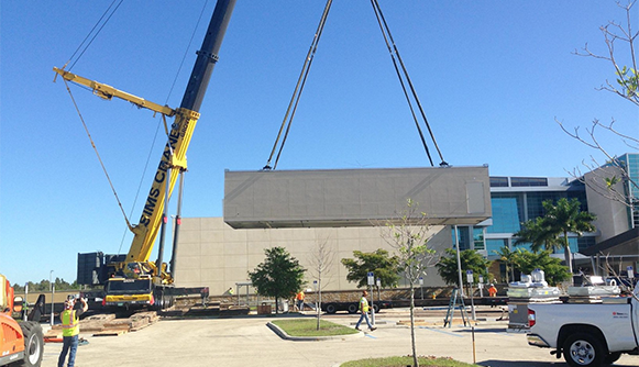 Crane lifting large assembly
