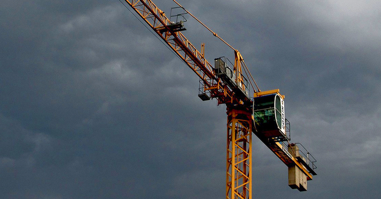 Crane with storm clouds