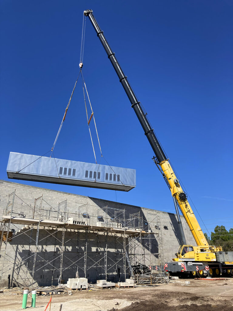 Crane lifting refrigerator unit